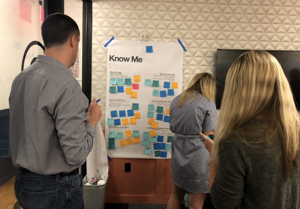 Multiple sticky notes on a board as INK employees conduct an interactive Think Wrong workshop